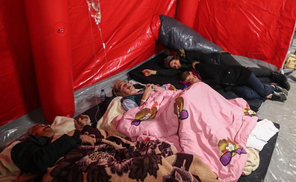 Injured people arrive at a hospital in Hatay following twin earthquakes  / ERDEM SAHIN